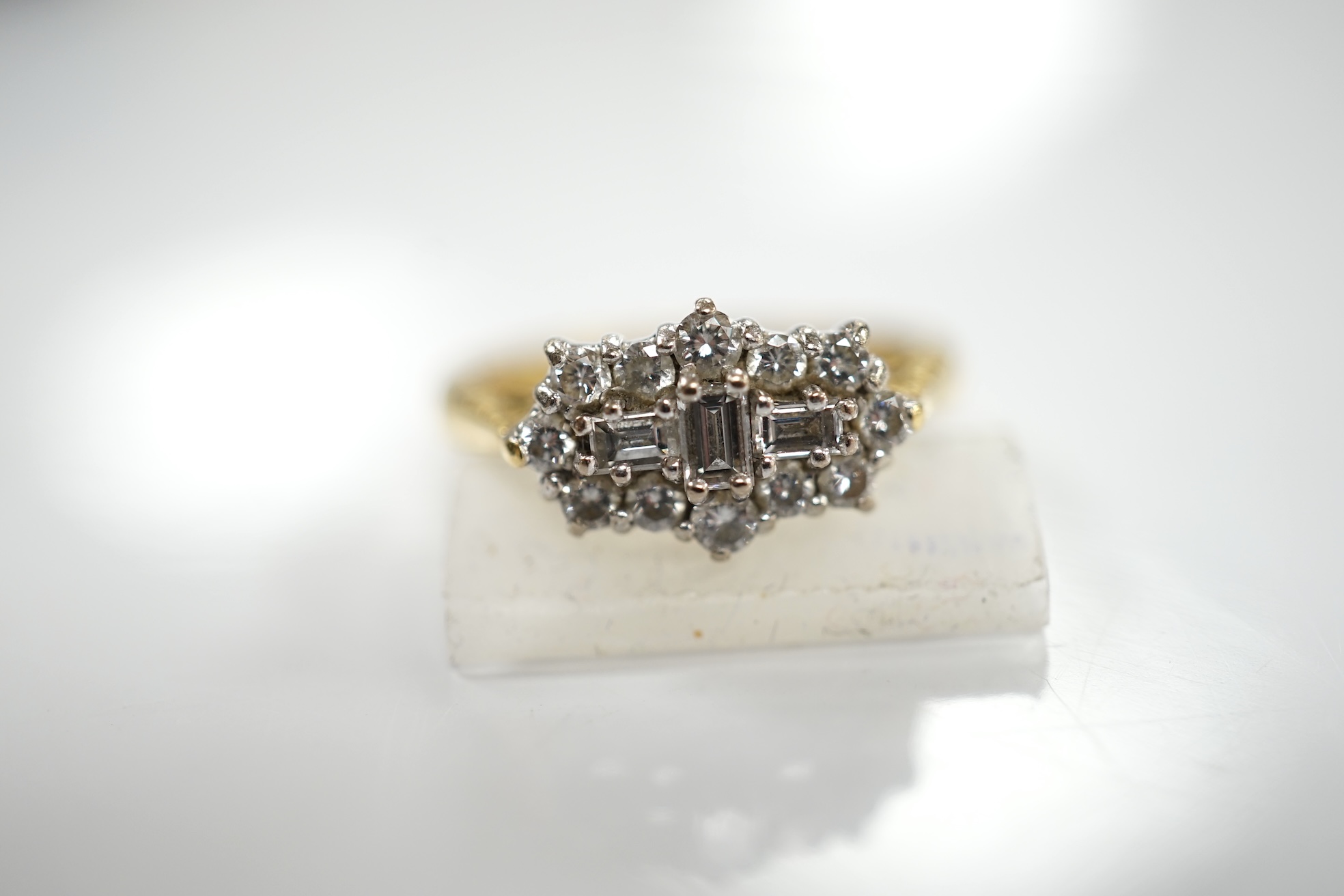 A modern 18ct gold and diamond cluster ring, size K, gross weight 4.4 grams. Condition - fair to good